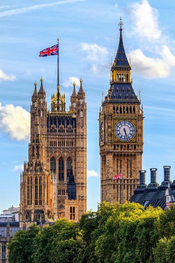 the big ben clock tower towering over the city of london in england, united kingdom