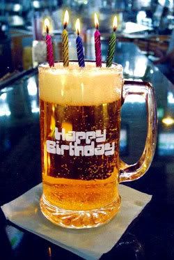 a beer mug with lit candles on it