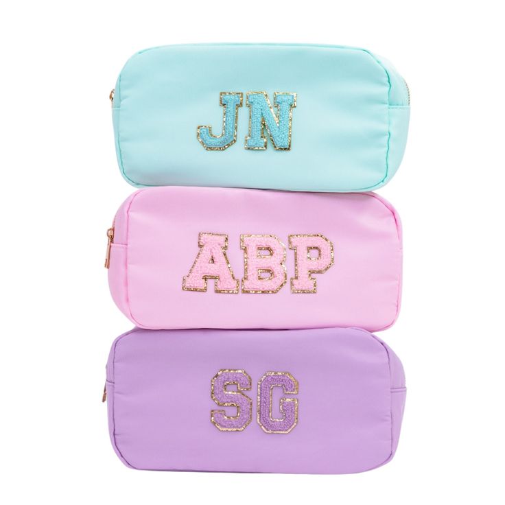 "These custom pouches are perfect for organizing your must-have essentials! Toss your sunnies and vacay essentials or tech or make-up in our Monogram Pouch or use it to store your make-up! How will you use your pouch? Details: - Nylon Zipper Pouch - Easy clean lining; spot clean exterior - Two Bag Size options - Medium Bag - 9.5\" x 5\" x 2\" - Large Bag - 10.3\" x 5.5\" x 3.3\" - Patches are permanently adhered, not sewn. - Patch Color Options: White, Mint, Light Pink, Lavender - Symbol Options Vacay Essentials, Pink Patch, Tout Rose, Floppy Beach Hat, Beach Weekend, Vanity Bag, Pool Bags, Bachelorette Trip, Medium Bag