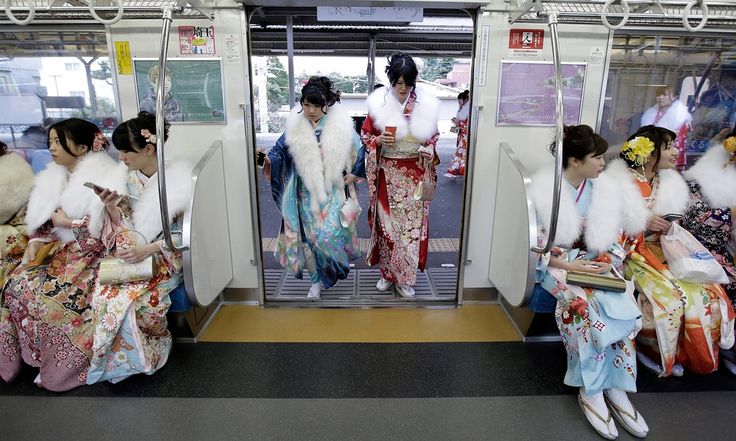 Japanese women in kimonos board a train after attending a ceremony on Coming of Age Day – a national holiday to celebrate those who have reached the age of 20, considered to be the beginning of adulthood Photograph: Kiyoshi Ota/EPA Coming Of Age Day, National Holiday, Japanese Outfits, World Cultures, Coming Of Age, Japanese Women, A Train, Tokyo Japan, The Age