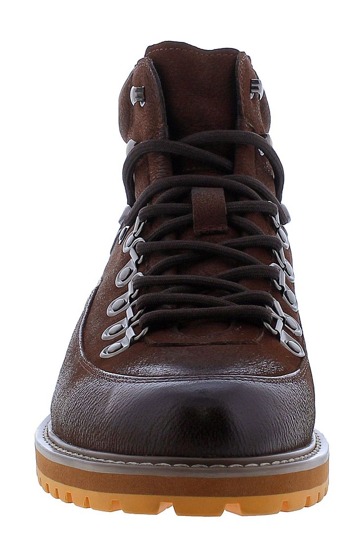 An embossed logo detail punctuates the pebbled-leather upper of a trail-inspired boot set atop a thick and durable outsole. Lace-up style Leather upper and lining/rubber sole Imported Winter Leather Hiking Boots With Lug Sole, Leather Lace-up Boots For Outdoor Work, Leather High-top Lace-up Boots With Reinforced Toe, Leather High-top Boots With Reinforced Toe, High-top Leather Boots With Reinforced Toe, Rugged Ankle-high Hiking Boots With Reinforced Heel, Leather Lace-up Boots With Round Toe For Outdoor, Leather Lace-up Boots For Outdoor Activities, High-top Lace-up Boots With Textured Sole For Outdoor