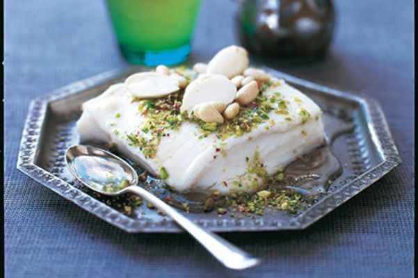 a piece of cake sitting on top of a silver plate