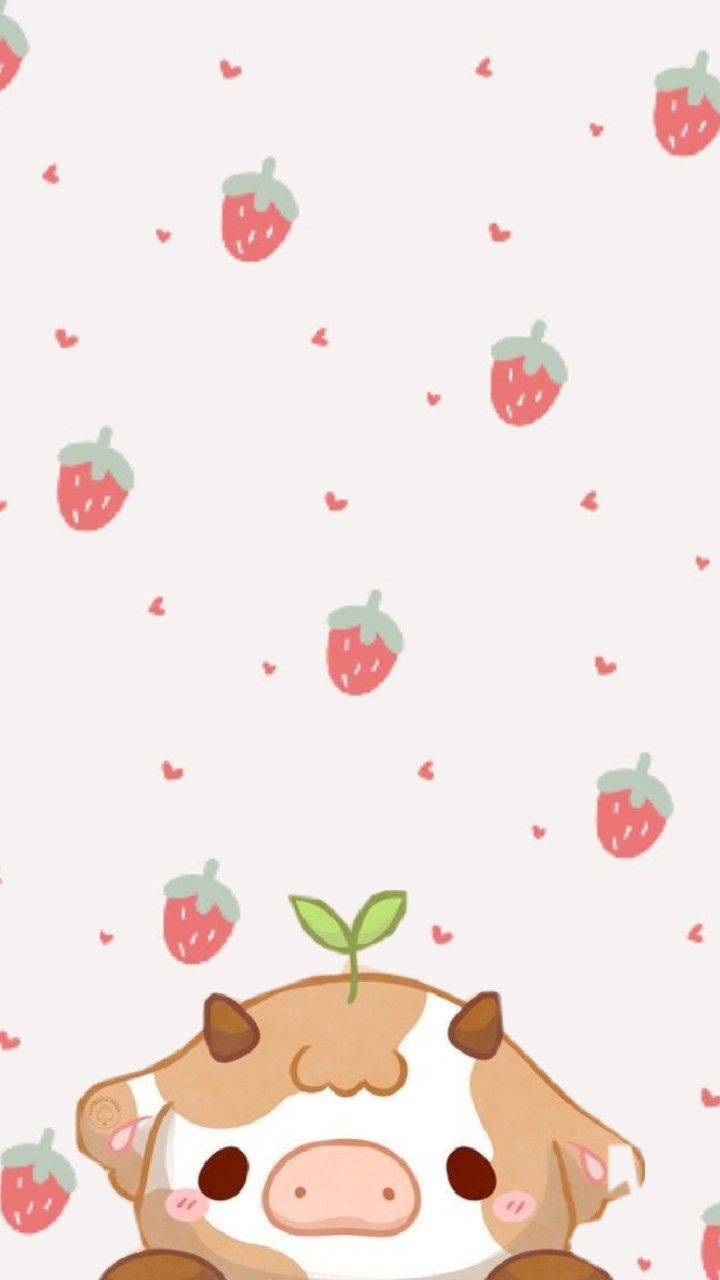 a cartoon cow sitting in front of a wall with strawberries on it