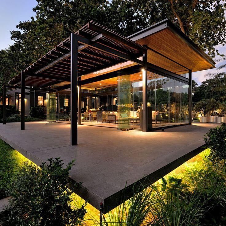 an outdoor covered patio with lights on it