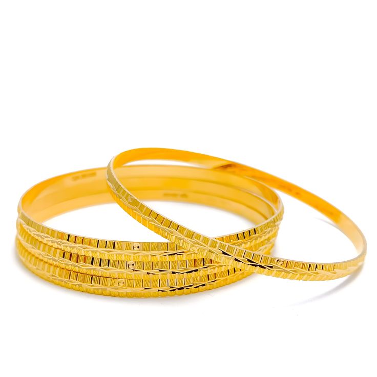 These Engraved High Finish Bangles are a must-have in any jewelry collection. Crafted from 22k yellow gold, this set of four bangles has a combined weight of 52.1 grams. The intricate engraving adds a touch of elegance to the high-gloss finish, making them a perfect statement piece. The bangles have a size of 2.8 and an opening of 2.5 inches. PRODUCT DETAILS Gold Purity(karat): 22k Gold Weight(grams): 52.1 Item Finish: Yellow Gold Bangle Size: 2.8 Bangle Opening: 2.5" Number Of Pieces: 4 Bangles 22k Gold Bangles, 5 Number, The Bangles, Yellow Gold Bangle, Gold Engraving, Gold Bangle, 22k Gold, Gold Bangles, High Gloss