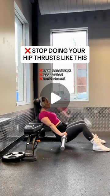 a woman is sitting on an exercise machine