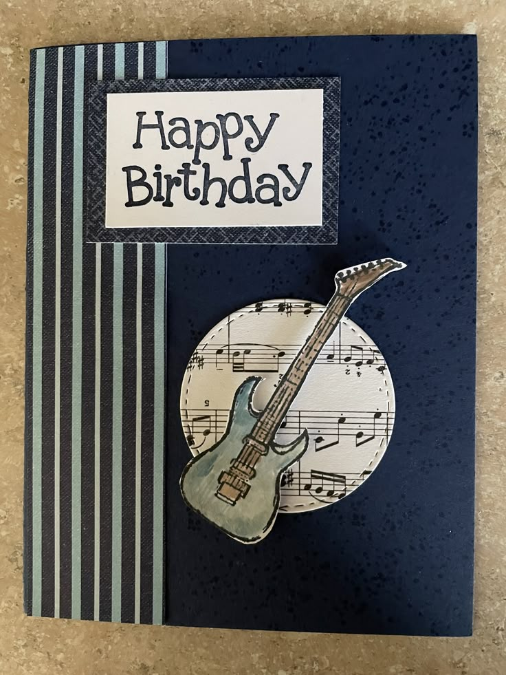 a birthday card with a guitar on it