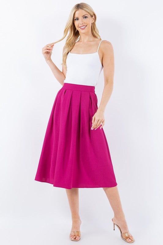 Vintage vibes with our box pleats midi skirts. Wear yours with a graphic t-shirt and sneakers, or dress it up with a fitted top and heels. Make it your own style for any occasion. Fit is true to size. Waistband has back elastic for stretch. Fabric: 100% polyester. Chic Summer Midi Pleated Skirt, Chic Summer Pleated Midi Skirt, Summer Midi Length Pleated Skirt For Day Out, Spring Stretch Midi Pleated Skirt, Trendy Summer Midi Pleated Skirt, Trendy Summer Full Pleated Skirt, Trendy Full Pleated Skirt For Summer, Trendy Spring Pleated Skirt For Day Out, Trendy Flowy Pleated Skirt For Day Out