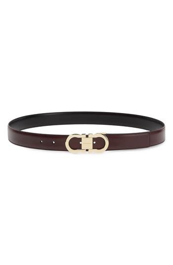 A high-polish Gancio buckle brings Ferragamo's signature motif to the front of a belt crafted for simplicity and distinction from glossy black leather. Leather Made in Italy Brown Leather Belt Buckle With Logo Plaque, Brown Leather Belt Buckles With Logo Plaque, Elegant Black Belt Buckles With Logo Plaque, Elegant Black Belt Buckle With Logo Plaque, Elegant Formal Belt Buckle With Logo Plaque, Designer Calf Leather Belt Buckle, Designer Calf Leather Belt Buckles, Designer Leather Belt Buckles With Palladium Hardware, Classic Calf Leather Belt Buckles For Formal Wear