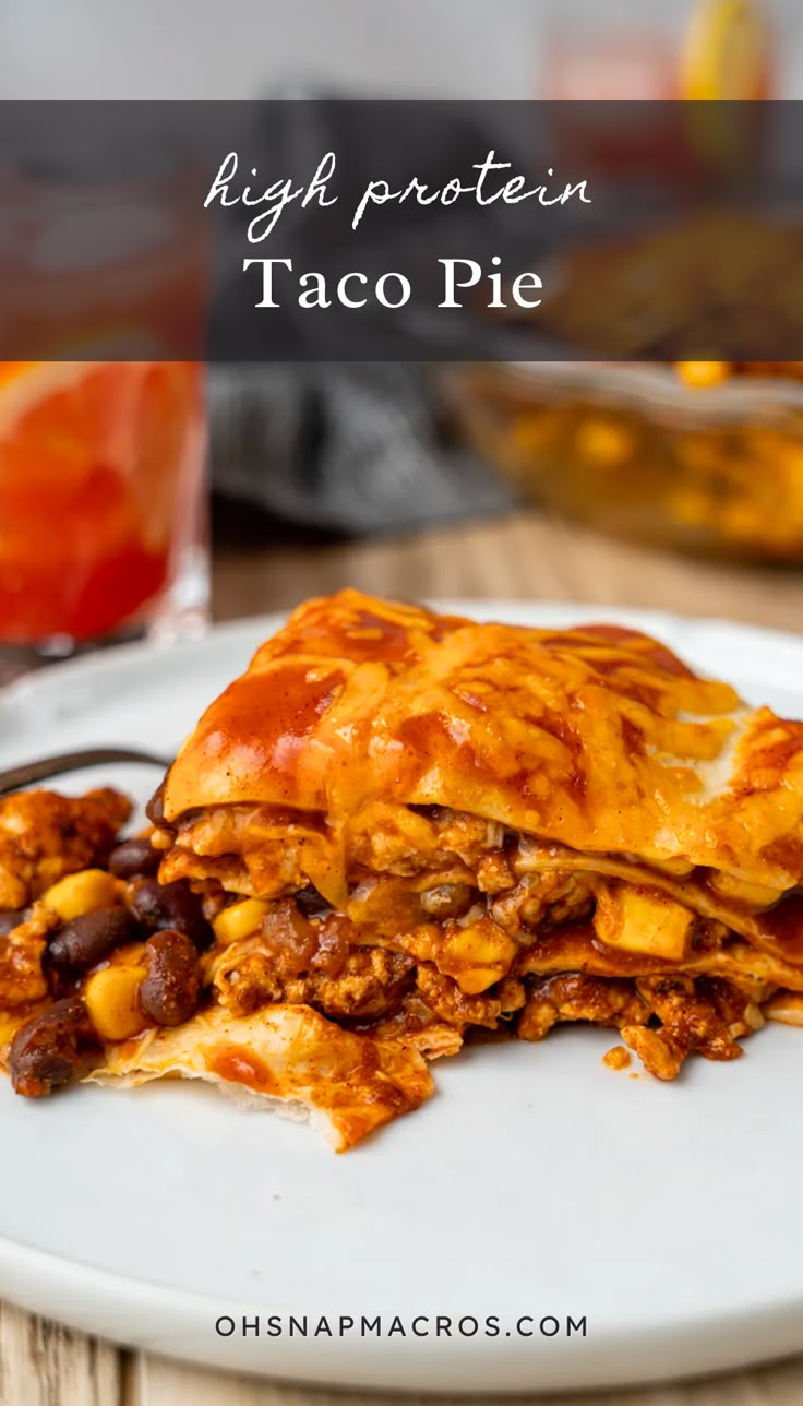 a white plate topped with taco pie covered in cheese