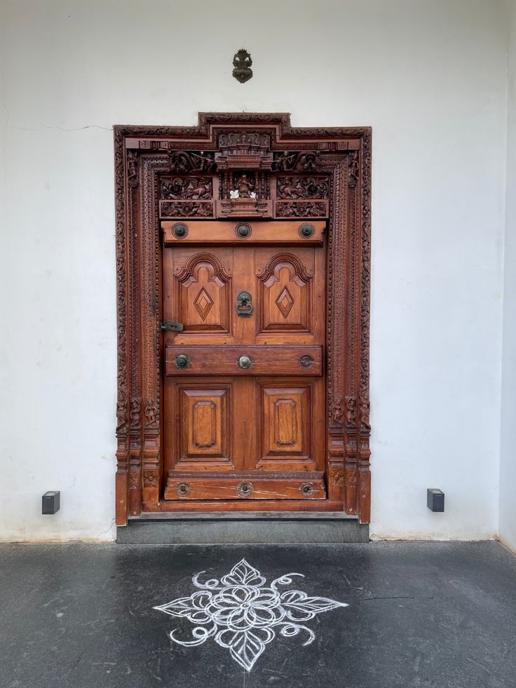 an old wooden door with intricate carvings on it