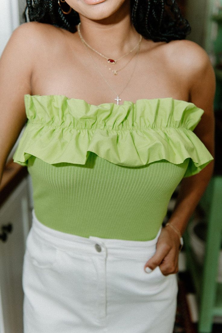 Unleash your vibrant side with our Lime Ruffle Strapless Tube Top. Not just ribbed and stretchy, but also featuring a playful ruffle hem detail, this lime green tube top will add a touch of fun to any outfit. Embrace the warm weather without worrying about slipping straps with this versatile and stylish top. runs true to size with lots of stretch model, Kennedi is wearing a size small Pretty Summer Tops, Green Tube Top, Stylish Top, Green Top, Green Tops, Summer Top, Ruffle Hem, Tube Top, Lime Green