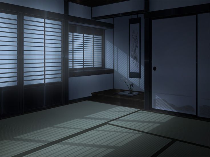 the room is dimly lit by the sun coming through the window and shutters on the door