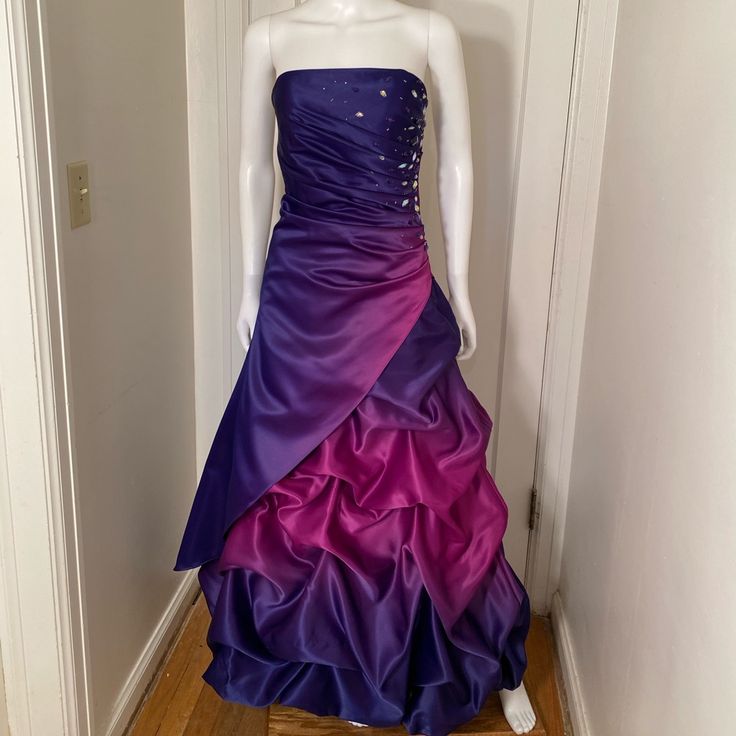 Stunning Ball Gown With Rhinestone Embellishments. Side Zipper. New Without Tags. All Sales Final Purple Sweep Train Dress For Prom Season, Purple Dresses With Sweep Train For Prom Season, Purple Dresses With Sweep Train For Prom, Purple Fitted Ball Gown For Prom Season, Purple Fitted Ball Gown For Prom, Purple Gown For Prom Season, Purple Fitted Floor-length Ball Gown, Purple Floor-length Ball Gown With Sweep Train, Purple Evening Dress With Sweep Train For Prom