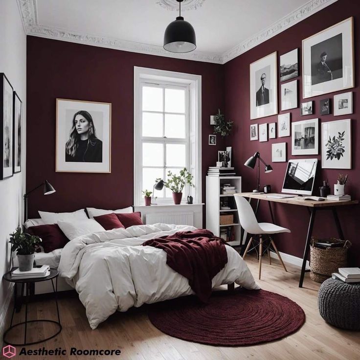 a bedroom with red walls and pictures on the wall above the bed, along with a rug