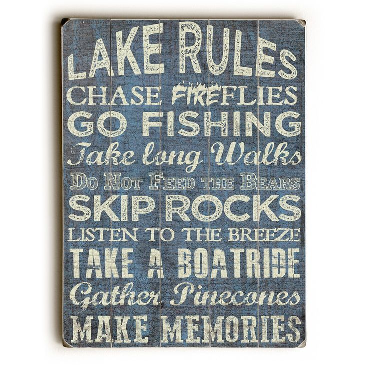 a wooden sign that says lake rules