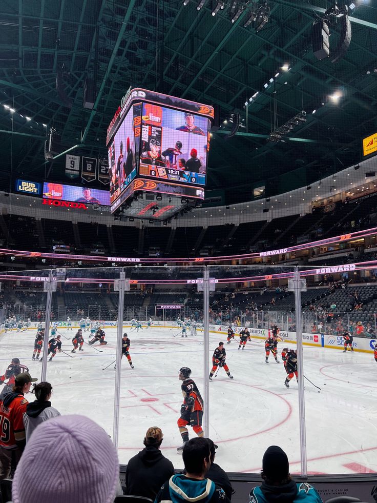 an ice hockey game is being played at the arena