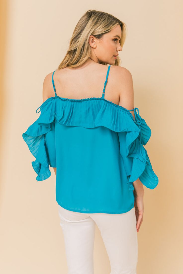 This cute lopez turquoise cold shoulder ruffled pleat top is perfect for your favorite looks! Featuring a ruffled pleat design, sleeveless and tie in. Ruffled pleat design Cold shoulder Sleeveless Turquoise print Fabric: 100% Polyester Spring Off-shoulder Ruffled Top, Off-shoulder Ruffled Tops For Vacation, Off-shoulder Ruffle Tops For Vacation, Chic Turquoise Spring Tops, Summer Off-shoulder Ruffled Tops, Summer Off-shoulder Top With Ruffles, Off-shoulder Ruffled Top For Beach, Off-shoulder Ruffled Summer Tops, Off-shoulder Ruffled Tops For Summer