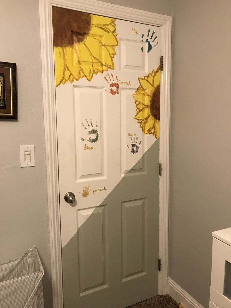 a door with sunflowers painted on it