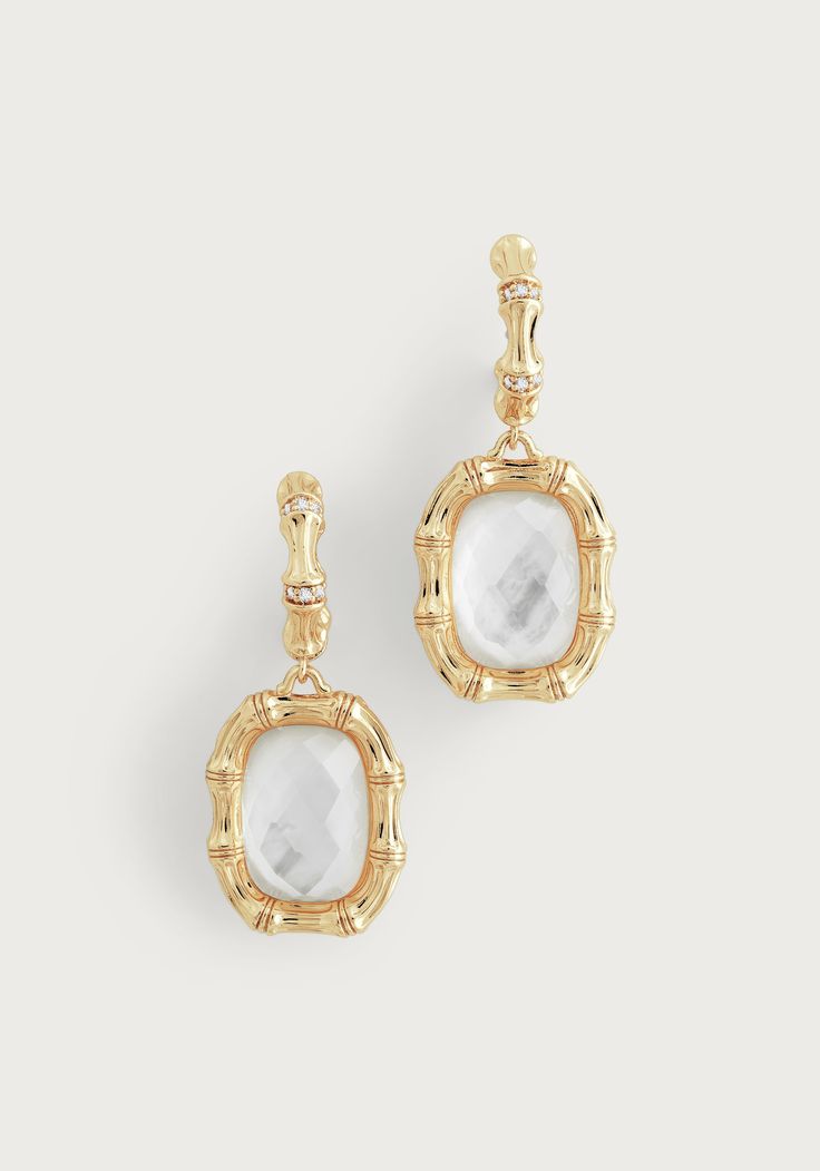 Crafted with exquisite detail, these earrings are effortlessly designed with 18K gold dipped brass, hand-placed pavé crystals, and mother of pearl to create a luxurious and timeless accessory suitable for any occasion. 18k gold dipped solid brass Crystals 1.5"L X 0.6" W Elegant Yellow Gold Mother Of Pearl Earrings, Elegant Pierced Jewelry In Mother Of Pearl, Elegant Mother Of Pearl Jewelry, Classic Mother Of Pearl Gold Earrings, Classic Gold Mother Of Pearl Earrings, Elegant Gold-tone Crystal Drop Earrings, Luxury Gold Crystal Earrings For Formal Occasions, Elegant Yellow Gold Plated Crystal Earrings, Elegant White Gold Plated Crystal Earrings