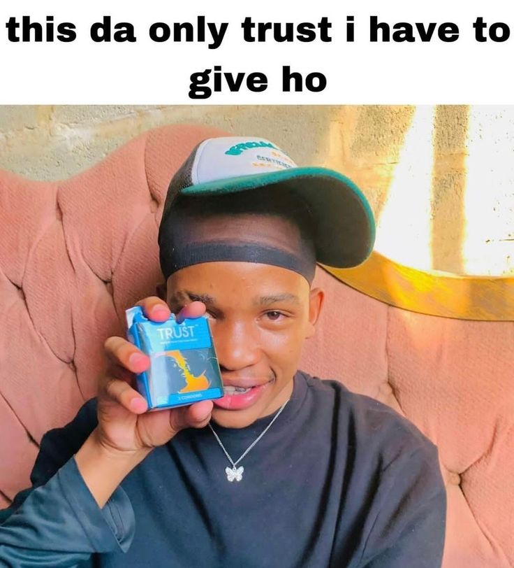 a young man is holding up a box with the caption'this da only trust i have to give ho '