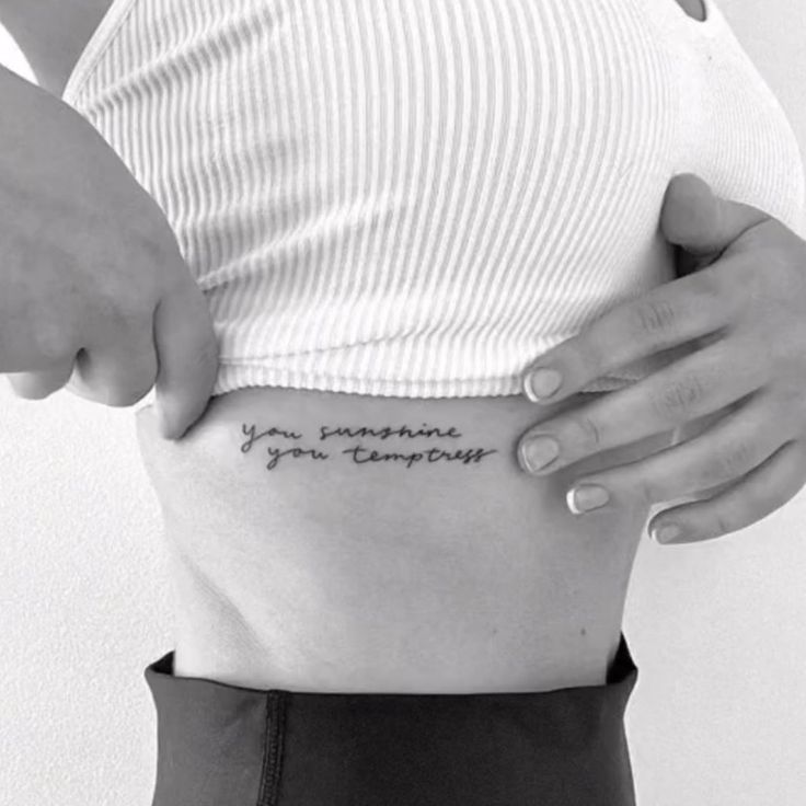 a woman's stomach with the words you are not supposed to be pregnant on it