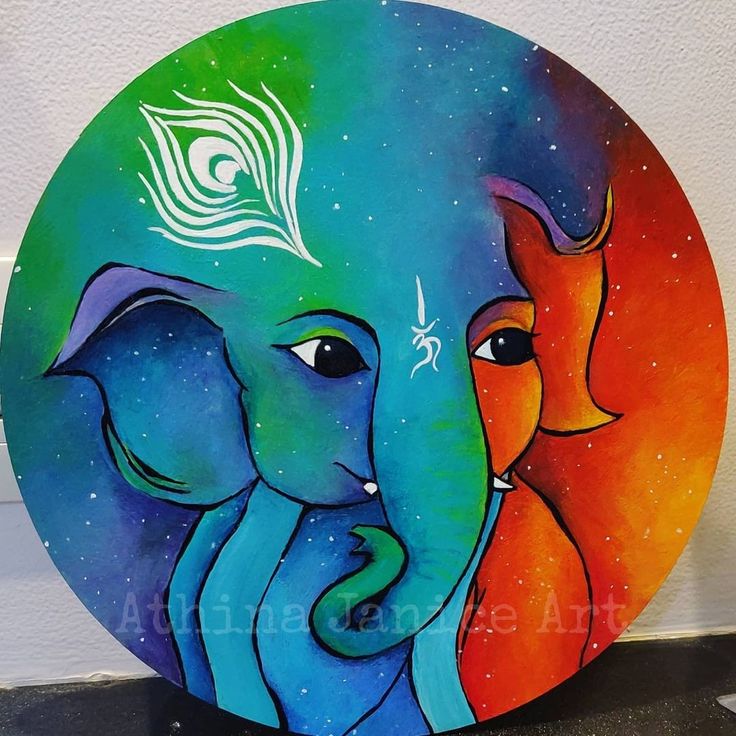 an elephant and a fox painted on a colorful plate with peacock feathers in the background