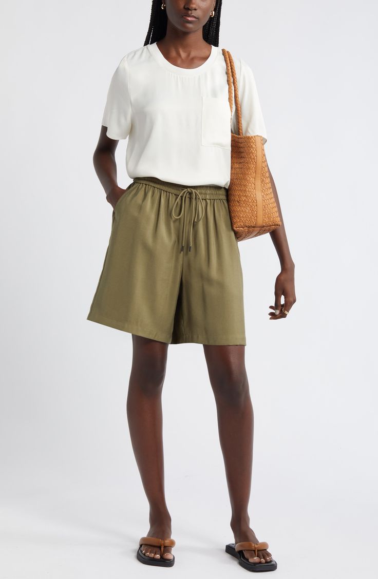 Slip into the casual ease of loose-fitting shorts topped with a comfortably customizable drawstring waist. Elastic/drawstring waist 91% viscose, 9% polyester Machine wash, line dry Imported Casual Vacation Shorts With Tie Waist, Spring Bermuda Bottoms With Drawstring, Casual Wide Leg Workwear Shorts, Casual Wide-leg Workwear Shorts, Casual Wide Leg Loungewear Shorts, Casual Wide Leg Shorts For Loungewear, Chic Short Bottoms With Drawstring, Chic Drawstring Short Bottoms, Chic Drawstring Shorts