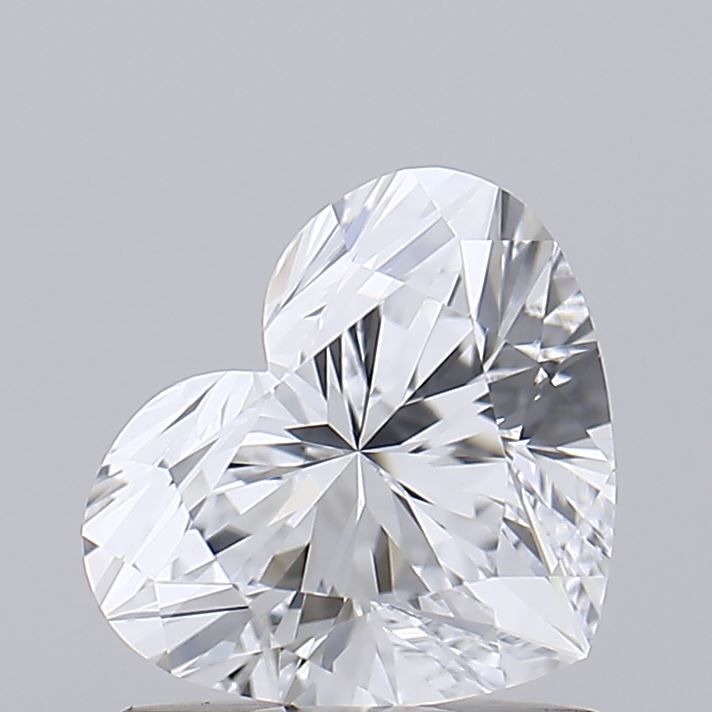 a heart shaped diamond sitting on top of a table