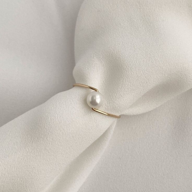 Add a touch of elegance to your everyday look with our 14k gold filled minimal pearl ring. This tiny stacking ring features a natural freshwater pearl, making it the perfect Midi ring for women who love understated sophistication. Whether you're shopping for yourself or looking for a thoughtful gift for your girlfriend or boyfriend, this dainty pearl ring is sure to be a cherished piece for everyday wear. All my gold pearl rings will delight you with its daintiness and quality. D E T A I L S * J Gold Ring With Pearl, Pearl Ring Design, Pearl Ring Simple, Natural Pearl Ring, 3rd Wedding Anniversary, Minimal Jewellery, Pearl Rings, Gold Pearl Ring, Minimal Ring