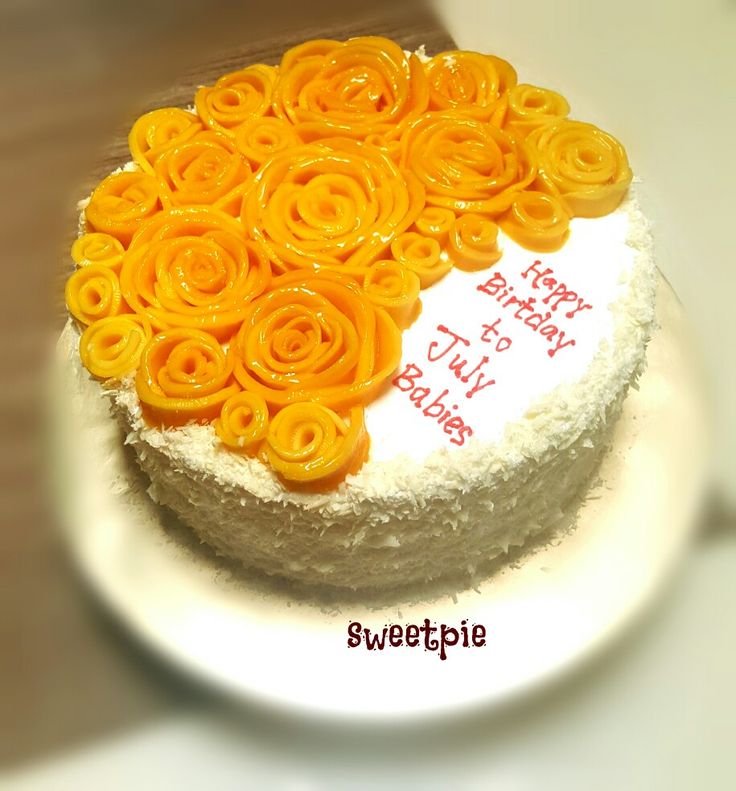 a birthday cake decorated with orange flowers on a white plate that says happy bday to my friend