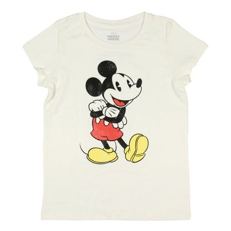 The Mickey Mouse Girls Cute Mickey Pose Kids Graphic Print Short Sleeve T-Shirt is a delightful and playful piece great for young Disney fans. This shirt features a charming graphic of Mickey Mouse in the center, captured in a classic pose with his arms crossed to the right and his left heel on the ground with his toe pointing up. The graphic showcases a distressed print style, adding a vintage and stylish touch that gives the shirt a distinctive look. Crafted from soft, breathable fabric, this Mickey Mouse Characters, Mickey Mouse Shirt, Mickey Mouse Shirts, Top Graphic Tees, Print Style, Kids Outfits Girls, Tee Shop, Neck Designs, Shirts For Girls