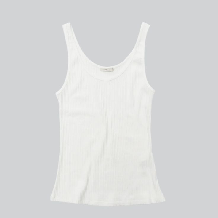 Your new favorite tank top. Slim ribbed scoop neck tank in a cozy modal jersey with stretch. Bra friendly. Mavaro wears a size small 94% modal, 6% elastane Tank Tops White, Outfit Inspo Casual, Denim Sweater, Christmas 2024, White Tank Top, White Tank, Shoe Sale, Dress Skirt, Knitted Sweaters