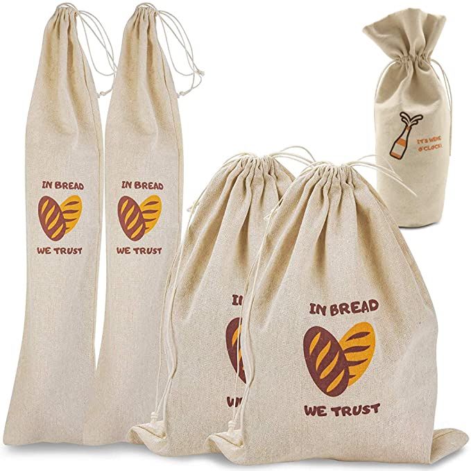 three bags with the words i'm bread we trust printed on them and two draws