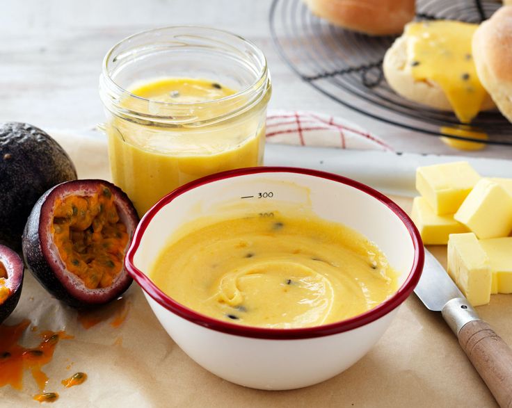 a bowl of soup next to some fruit and cheese