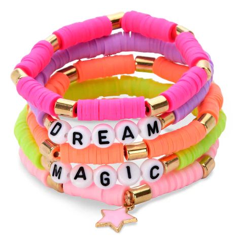 four different colored bracelets with words and stars on the ends, one saying dream magic