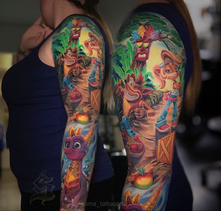 two women with colorful tattoos on their arms