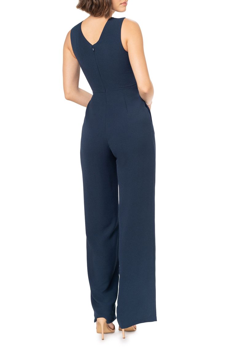 Stand tall whether you're off to the office or brunch in this stretch-kissed jumpsuit that gives you legs for days thanks to a high waist and long straight legs. 61 1/2" length Deep V-neck Sleeveless Partially lined 97% polyester, 3% spandex Machine wash, dry flat Imported Elegant V-neck Elastane Jumpsuits And Rompers, Formal Stretch Strapless Jumpsuit, Elastane Jumpsuits And Rompers, Elegant Fitted Strapless Jumpsuit With Wide Leg, Elegant Strapless Wide-leg Jumpsuit For Work, Fitted Strapless Wide-leg Jumpsuit For Date Night, Date Night Strapless Wide-leg Jumpsuit, Strapless Wide Leg Jumpsuit For Date Night, Elegant Wide Leg Strapless Jumpsuit For Work