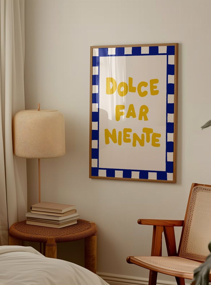 a room with a bed, chair and poster on the wall above it that says dolce far nintee