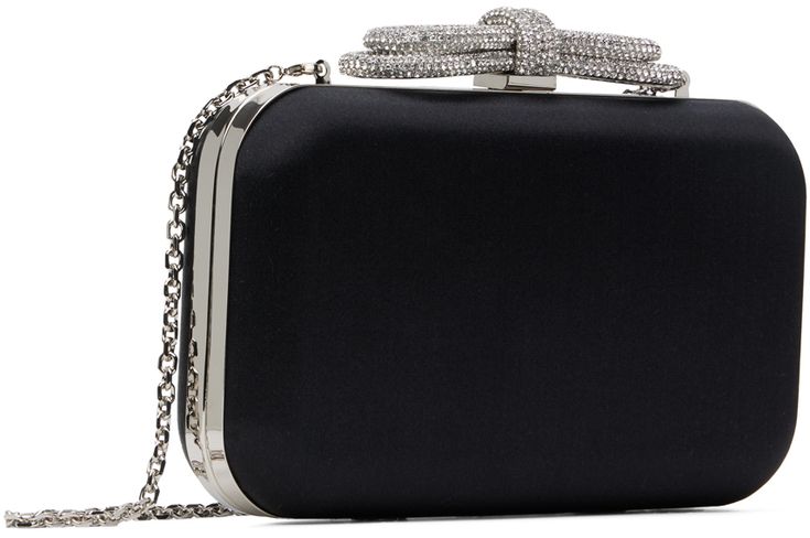 Structured satin clutch in black. · Detachable curb chain shoulder strap · Crystal-cut bow appliqué at clasp · Hinged closure · Grained leather lining · H4.5 x W8 x D2 Supplier color: Black Black Evening Bag With Chain Strap For Formal Occasions, Black Evening Bag With Chain Strap For Formal Events, Chic Formal Evening Bag With Bow, Black Rectangular Evening Bag For Cocktail, Black Rectangular Evening Bag For Gala, Black Glamorous Clutch For Formal Events, Black Evening Bag For Gala, Glamorous Black Clutch For Formal Occasions, Elegant Black Bag For Cocktail