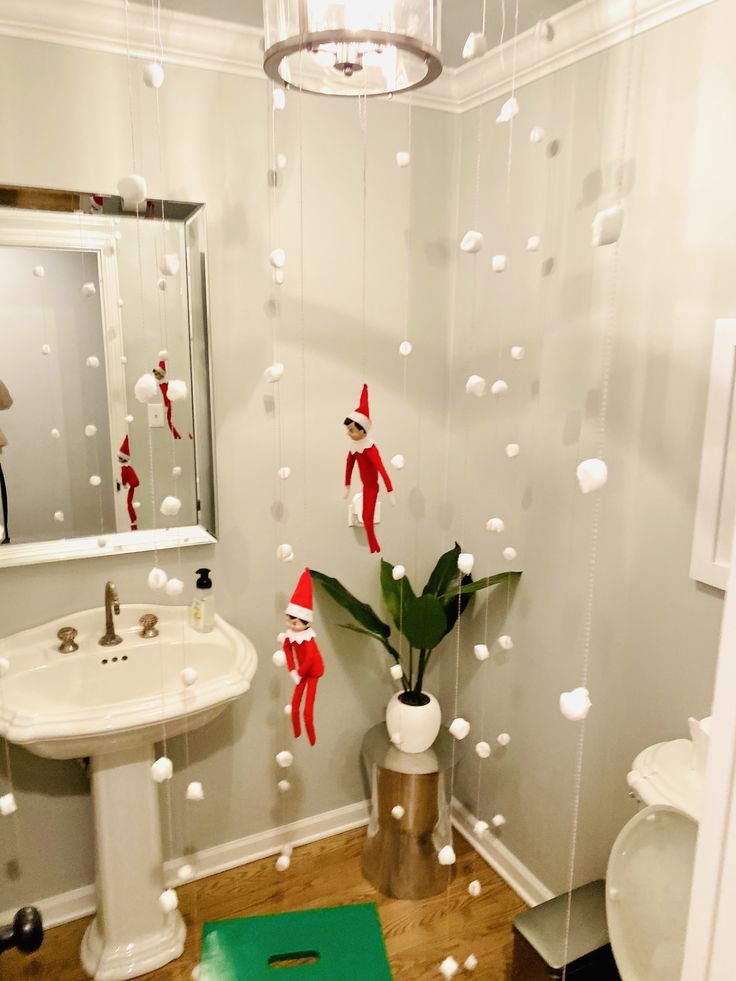 a bathroom decorated for christmas with elf decorations