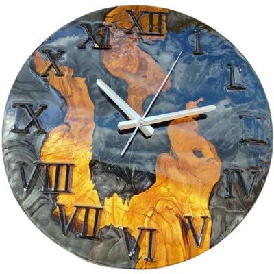 a clock that is on the wall with roman numerals and numbers painted on it