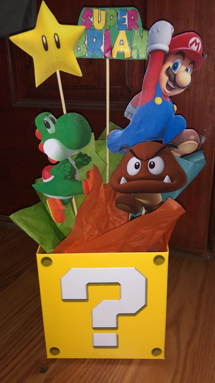 a super mario birthday centerpiece in a box