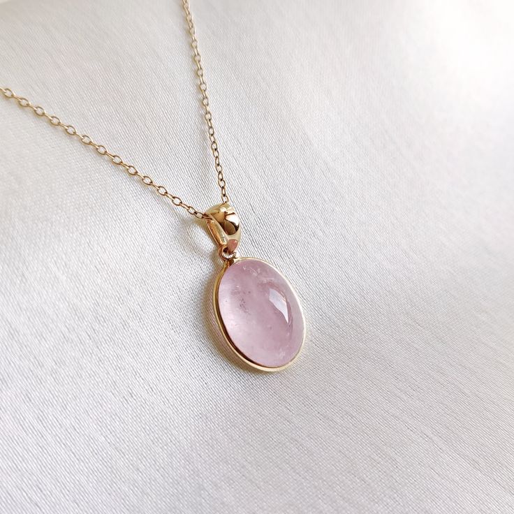 This stunning pendant is set in 14k Solid Yellow Gold with Natural Morganite with utmost precision. It is an unique gemstone pendant for nearly every occasion and is completely hassle-free jewelry. ITEM DETAILS: * Gem: Morganite * Gem Size: 10X13mm * Gem Shape: Oval * Gem Eeight: 6.46 carats * Gold Purity: 14KT * Gold Weight: 0.56 gram * Total Weight of the Pendant: 1.85 gram The Gold purity is guaranteed and it comes with authentic 14KT gold hallmark. Since my items are handmade, they are absolutely nickel and lead free. CUSTOMIZATION: * Gemstone customization is available and it can be substituted with a gem of your choice. Kindly message me for the same. PACKAGING * The Pendant comes with layers of safe and secure wrapping along with Free handmade jewelry box with every purchase. ➡️Head Oval Yellow Gold Birthstone Necklace With Gemstone, Rose Gold Gemstone Oval Pendant Jewelry, 14k Gold Pendant Gemstones With Gemstone Accents, Rose Gold Oval Pendant Jewelry With Gemstone, Dainty Oval Gemstone Pendant Jewelry, Dainty Oval Pendant Gemstone Jewelry, Oval Birthstone Gemstones In 14k Gold, Oval Gemstone Birthstone Necklace In Fine Jewelry Style, 14k Yellow Gold Gemstones For Gift