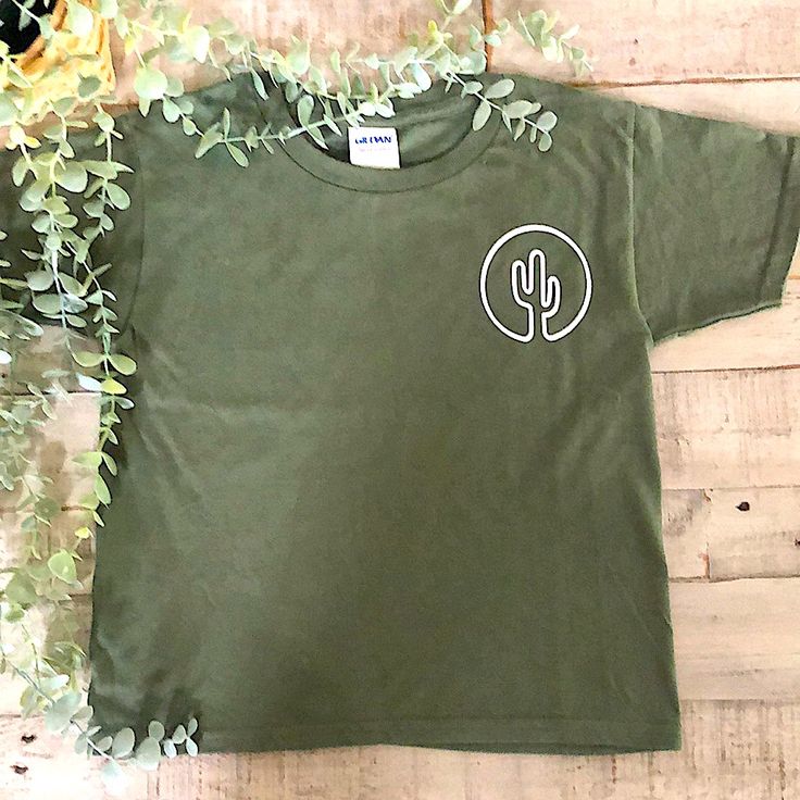 This Cactus Green Shirt Is Just Perfect For Any Occasion, This Shirt Is A Olive Green Color With White Cactus Outline, The Brand Is Gildan, The Shirt Material Is 100% Preshrunk Cotton, Size 6t, The Shirt Is 15”X 18” Made In Honduras, Cactus Outline, White Cactus, Superman T Shirt, Moschino Kids, Yellow Ties, Tie Dye Shirts, Adidas Girl, Navy Blue Shorts, Beach T Shirts