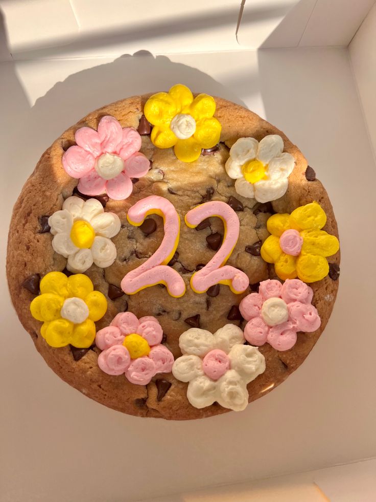 a decorated chocolate cookie with flowers and the number twenty two