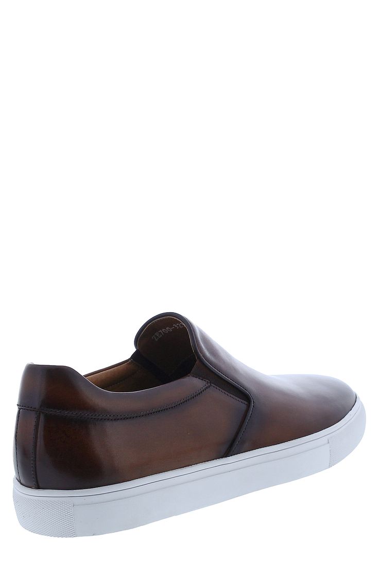 Smooth leather shapes this handsome slip-on sneaker lifted by a bold white sole and offers premium comfort with soft memory foam cushioning. Leather upper and lining/rubber sole Imported Brown Low-top Slip-ons With Contrast Sole, Classic Brown Low-top Slip-ons, Brown Slip-on Sneakers With Cushioned Footbed, Brown Low-top Slip-ons With Ortholite Insole, Brown Slip-on Sneakers, Brown Low-top Slip-ons With Cushioned Footbed, Leather Slip-ons With Cushioned Footbed And White Sole, Brown Low-top Cushioned Slip-ons, Brown Low-top Slip-ons With Rubber Sole