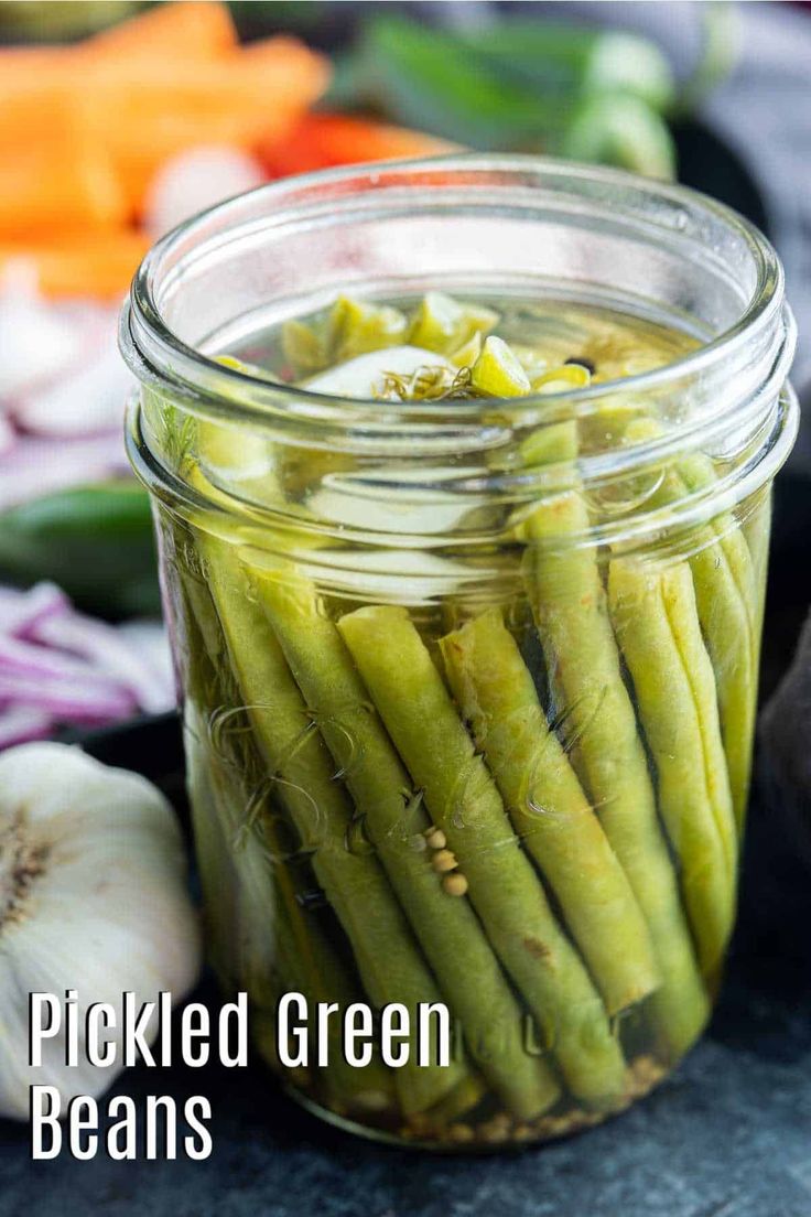 pickled green beans in a jar with garlic