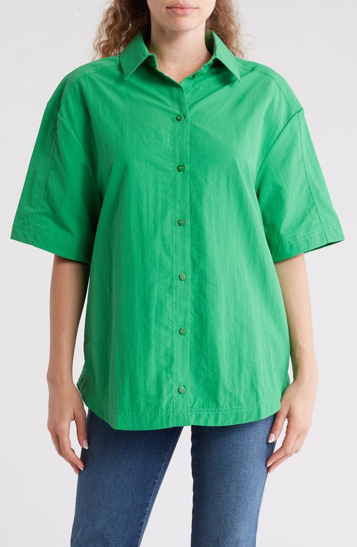 Throw on this short-sleeve button-up shirt constructed in a boxy, oversized fit that's easy to layer. Front button closure Spread collar Short sleeves 100% nylon Machine wash, line dry Imported Solid Spring Camp Shirt With Buttons, Green Short Sleeve Button Shirt For Spring, Green Short Sleeve Shirt With Buttons For Spring, Oversized Spring Button-up Camp Shirt, Oversized Button-up Camp Shirt For Spring, Solid Short Sleeve Shirt With Button Closure For Spring, Solid Color Relaxed Fit Camp Shirt For Spring, Spring Green Camp Shirt With Buttons, Spring Green Short Sleeve Shirt With Button Closure