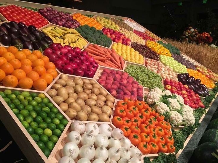 there are many different fruits and vegetables on display